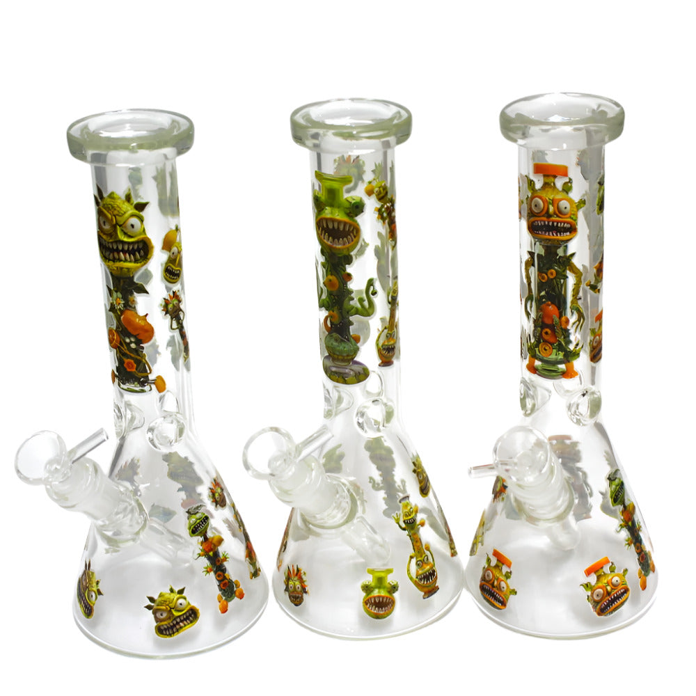 10 Inch Glow in the Dark Monster Design Beaker Glass Water Pipe Featuring Colorful Monster Decals, a 14mm Male Glass Bowl, Glass-on-Glass Connection, and a Wide Beaker Base for Retail and Wholesale Supply