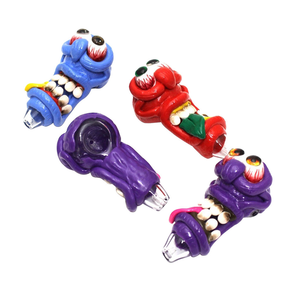 4-inch monster-inspired art glass hand pipe featuring colorful artwork, heavy-duty glass construction, smooth finish, compact design, and distinctive character styling.