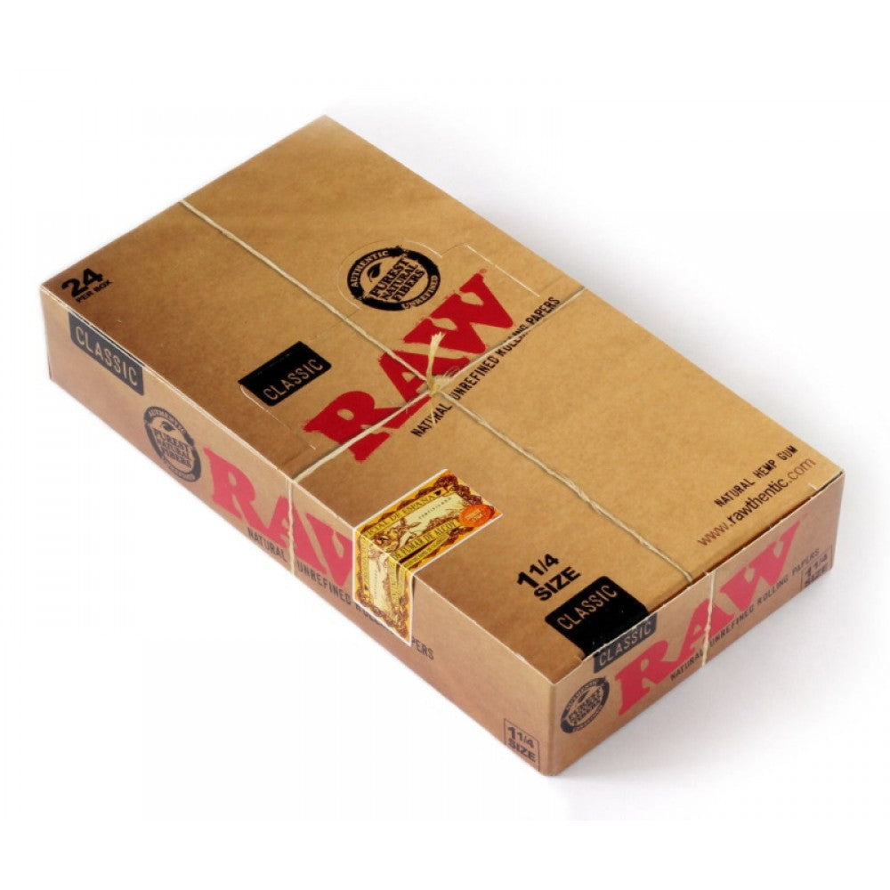 RAW Classic 1¼ Size Rolling Papers with 24 papers per pack, featuring classic RAW branding, lightweight paper, natural brown color, and compact packaging.