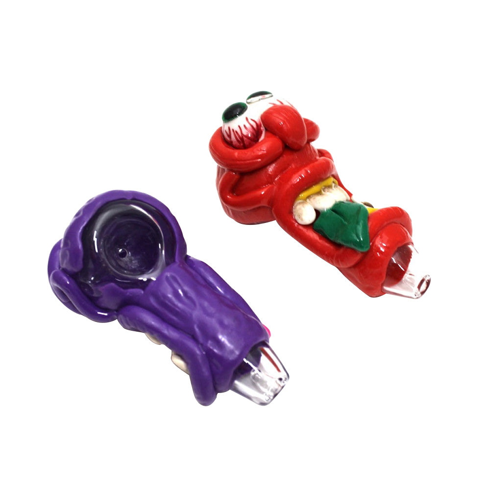 4-inch monster art design heavy-duty glass pipe featuring colorful character artwork, durable glass construction, smooth polished finish, compact profile, and unique styling.