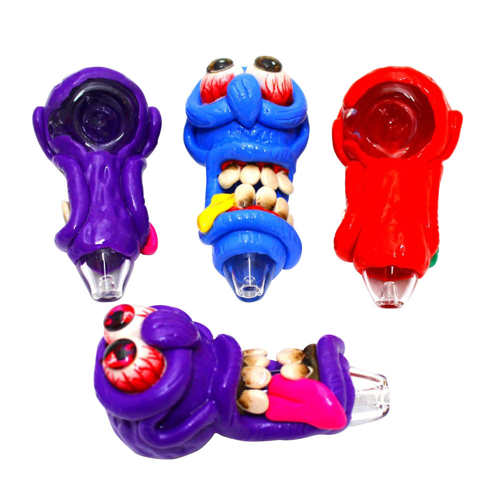 4-inch monster design art heavy-duty glass hand pipe featuring colorful monster-inspired artwork, sturdy glass construction, smooth finish, compact size, and distinctive styling.