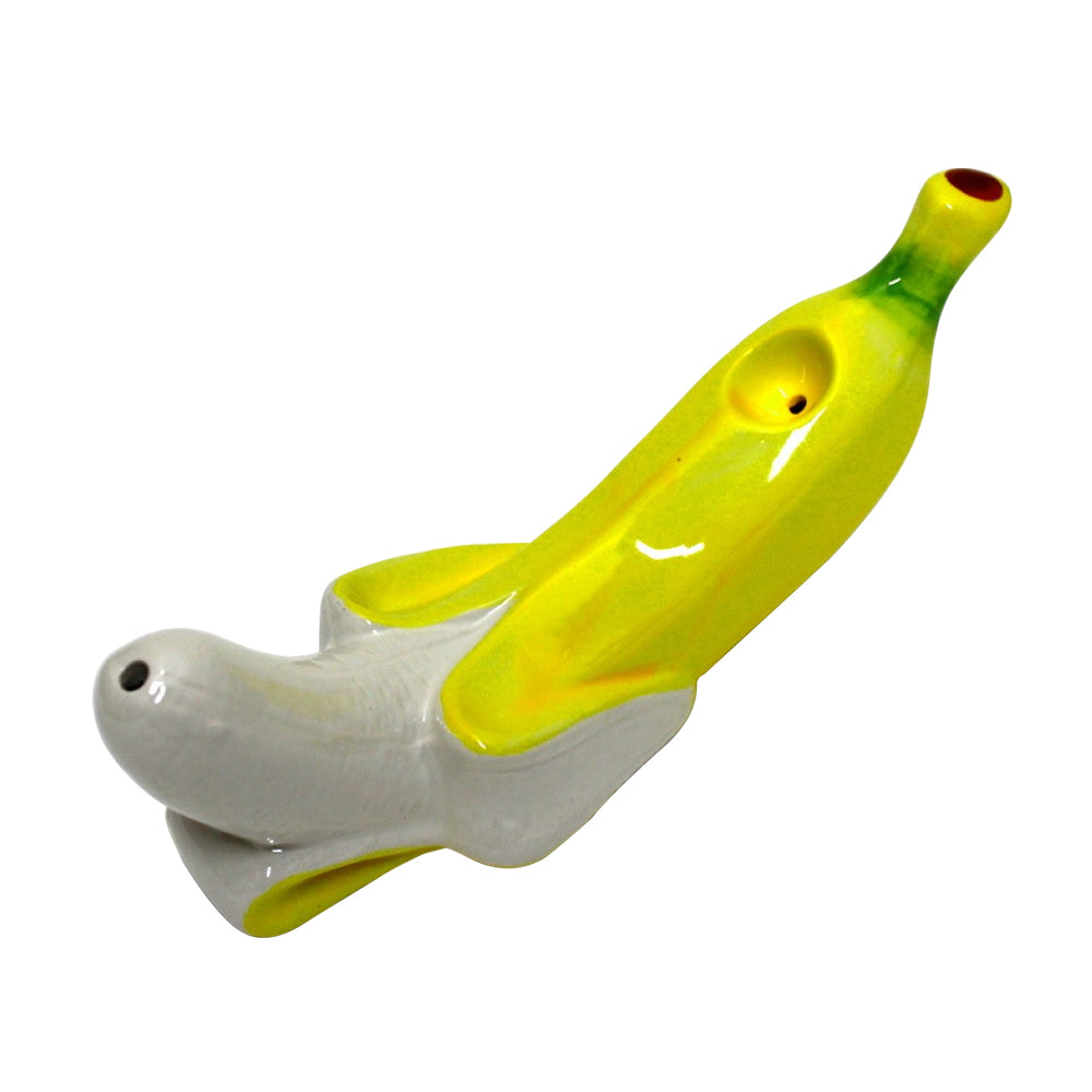 8-inch banana design ceramic hand pipe featuring a unique curved shape, durable ceramic construction, smooth finish, and decorative artwork.